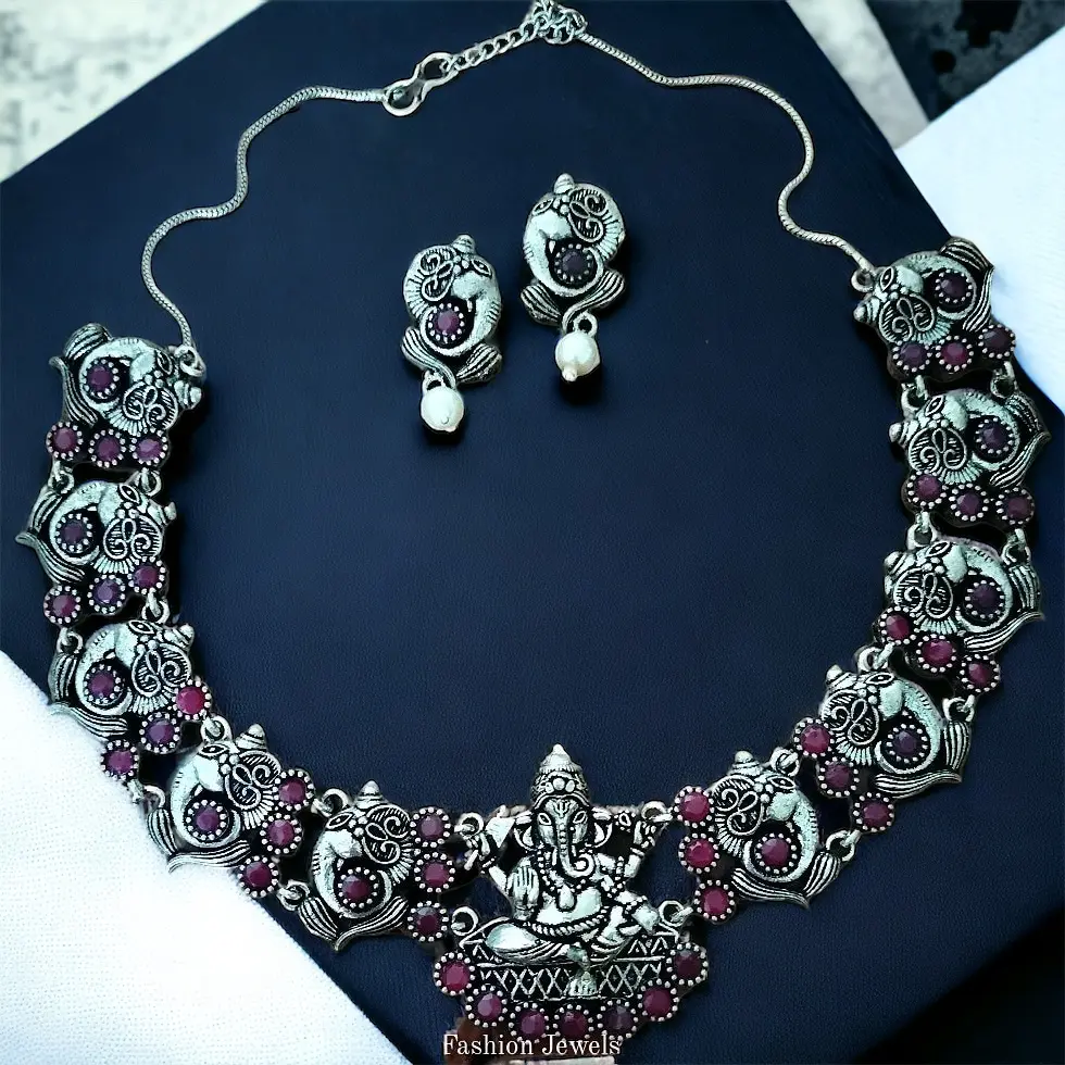 GermanSilverRubyGaneshaPearlSet-FashionJewels2.webp