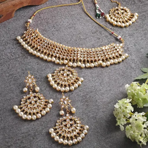 Golden kundan pearl statement Necklace and Mangtika set